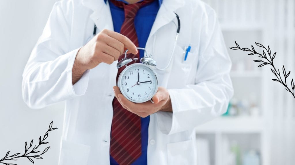 Man wearing medical robes and holding a clock in his hand