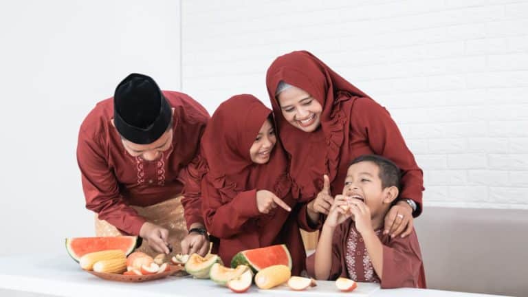 family laughing together as they eat