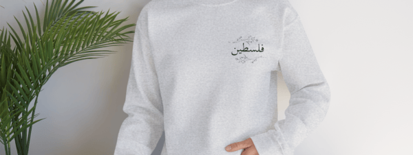 Palestine crewneck ash worn by a woman