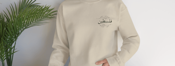 Palestine crewneck sand worn by woman