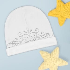 Muslim beanie for babies with some knitted stars next to it